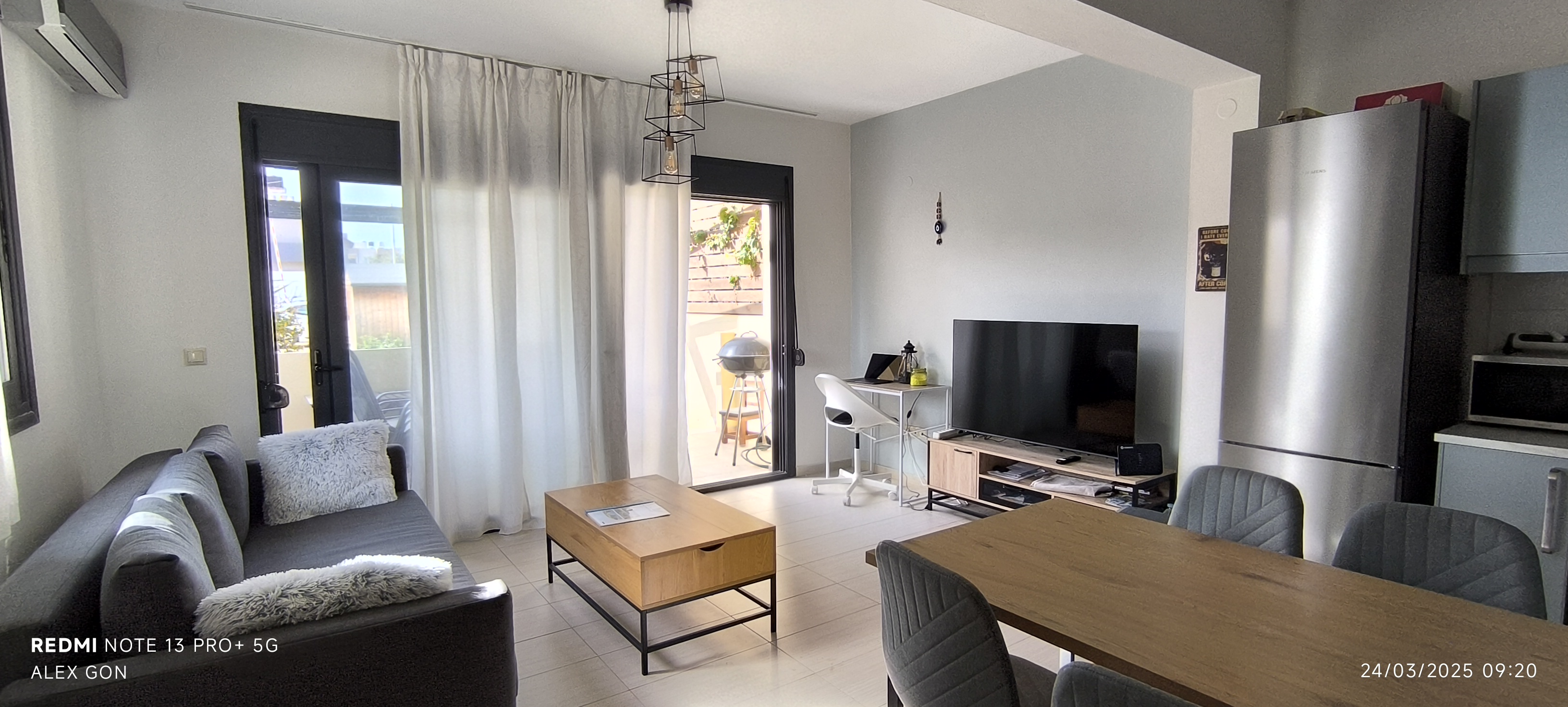 Living area workspace — desk, monitor hook-up, and room to spread out