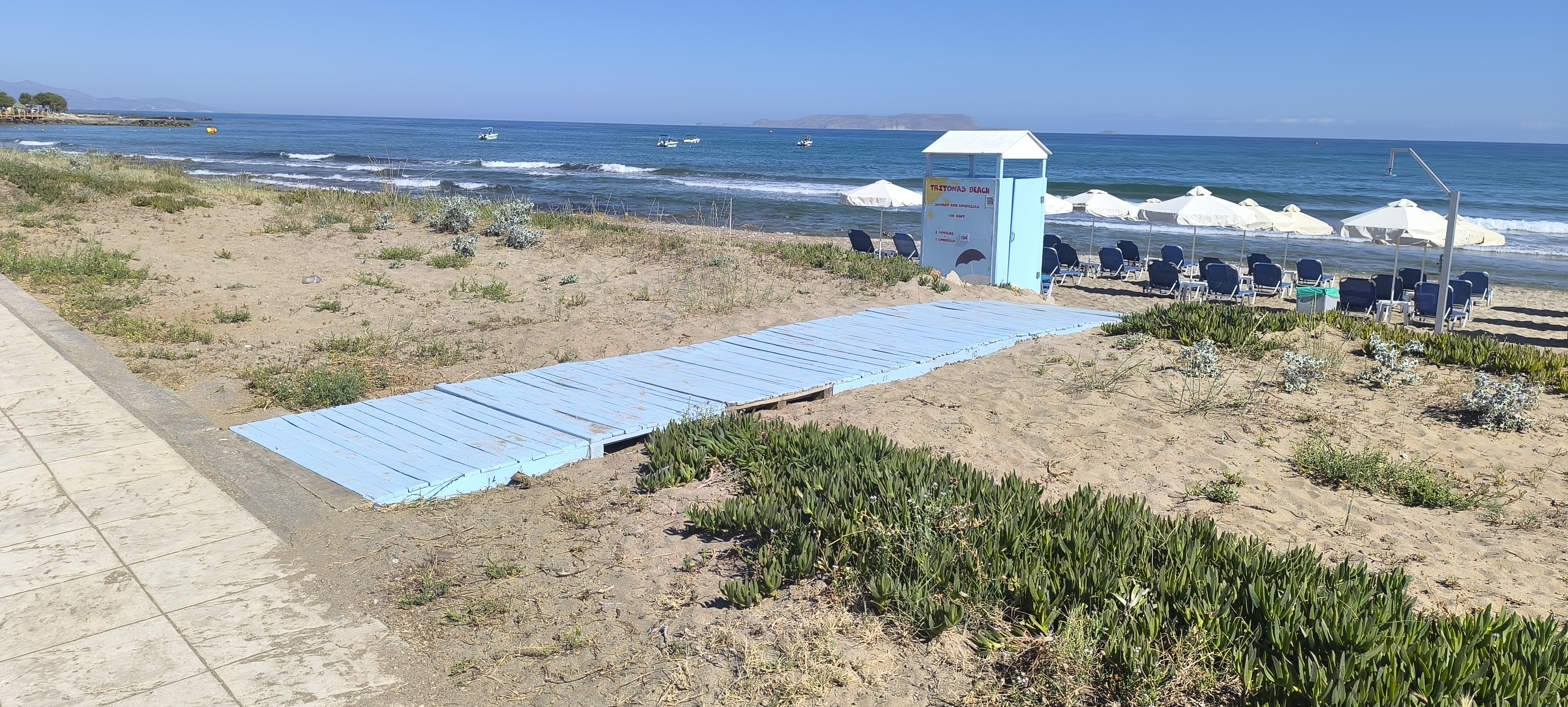 Morning light on Analipsi sand — shallow entry suits calm families